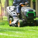 Professional,Lawn,Mower,With,Worker,Cutting,The,Grass,In,A